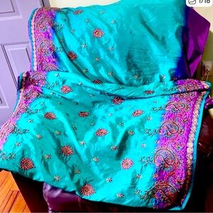 Beautiful, gorgeous ethnic wear with teal green and purple embroidery stones.